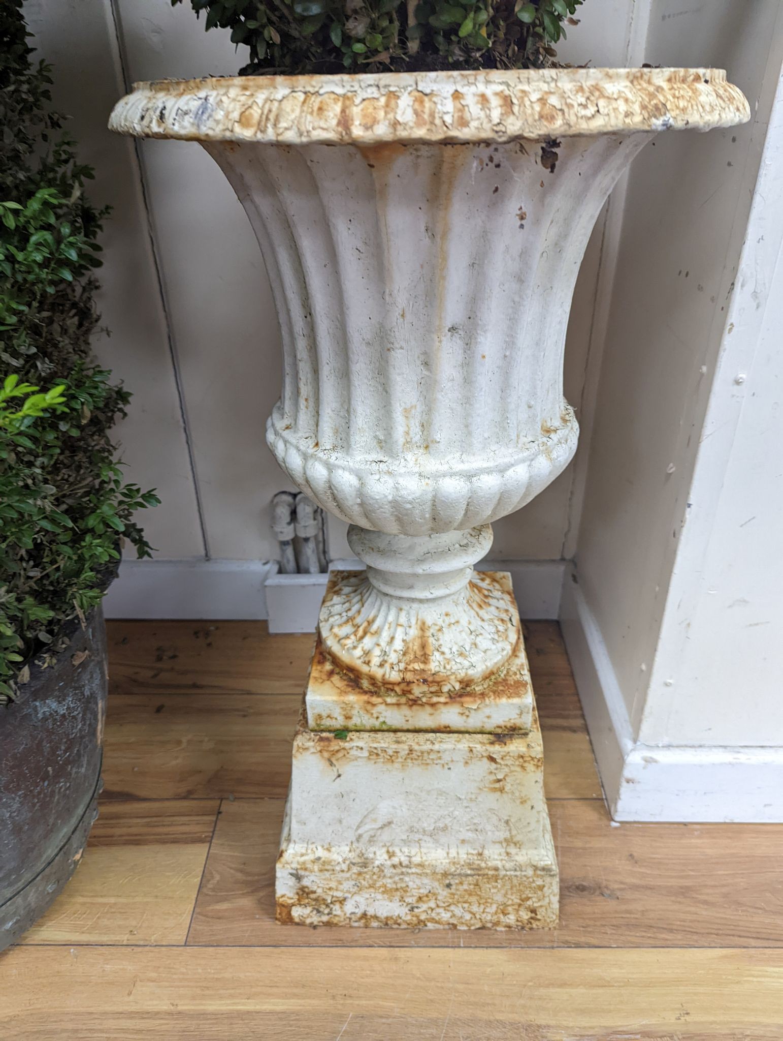 A pair of Victorian painted cast iron campana garden urns, height 70cm